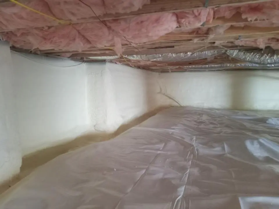 Crawl space encapsulation with closed-cell spray foam for Commercial Roof Restoration in Elsmere